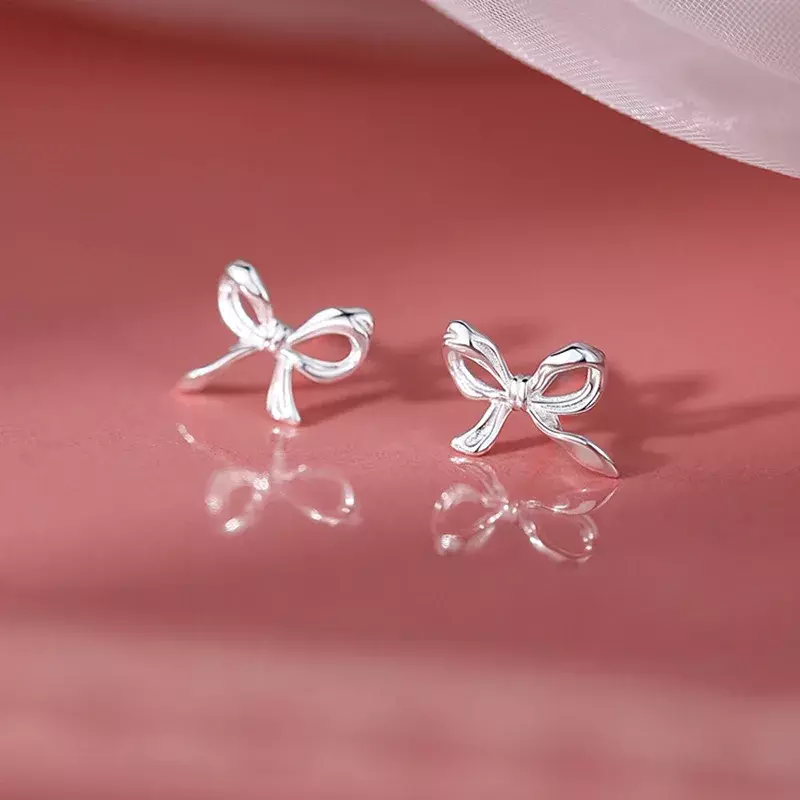 1 par de pendientes de plata con forma de lazo para mujer, Color plateado, Piercing de oreja minimalista Simple, regalo de joyería
