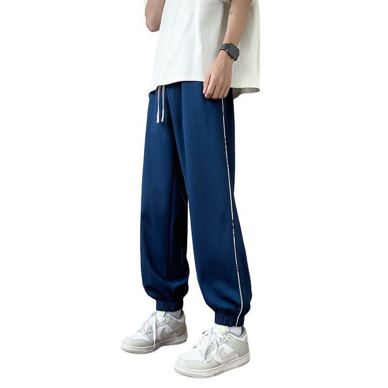 Pantalones informales de tendencia fina para hombre, mallas sueltas versátiles de Color sólido, primavera y verano, novedad