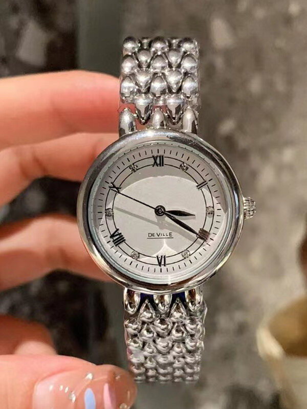 Orologio al quarzo con specchio in vetro zaffiro con cinturino integrato con cassa in acciaio di design 2024 nuovo orologio da donna di lusso di moda