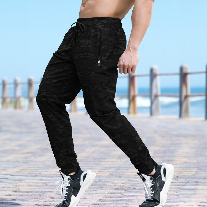 Celana olahraga pria, celana olahraga regang cepat kering untuk latihan luar ruangan Jogging kasual saku ritsleting