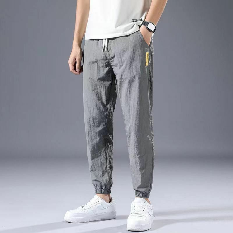 Summer New 2024 Ice Shreds Bound Feet Men Solid Color Pants Loose Casual Comfortable Elastic Waist All-match Nine Point Pants