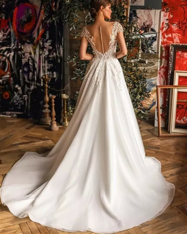 LoveDress Modern V-Neck Wedding Dress Cap Sleeve Lace Appliques Pleats Bohemian A-Line Bride Gown Illusion Backless Button Train