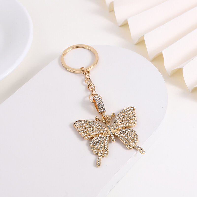 LLavero de mariposa de diamantes de imitación brillantes para mujeres y niñas, lindo Animal volador creativo, bolsa de insectos colgante, accesorios de decoración