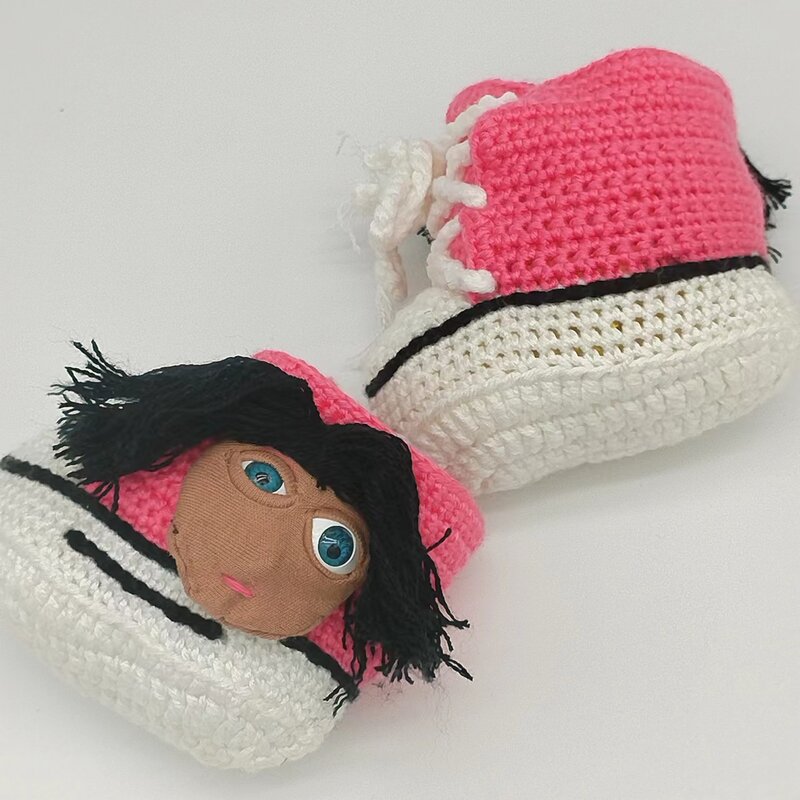 Il letto morbido del bambino usa il bottino delle scarpe del calzino