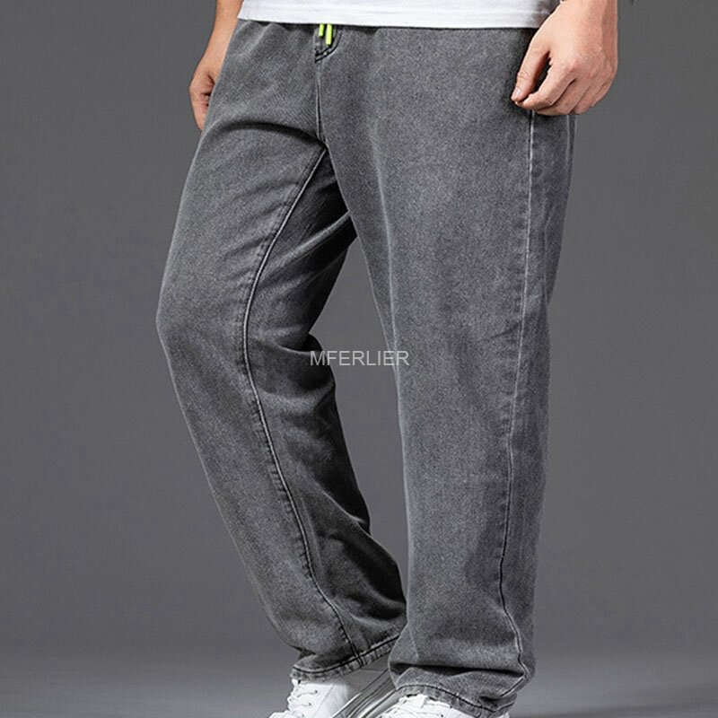 Letnie wiosenne dżinsy w dużym rozmiarze dla mężczyzn w pasie 145cm bawełniane luźne spodnie 44 46