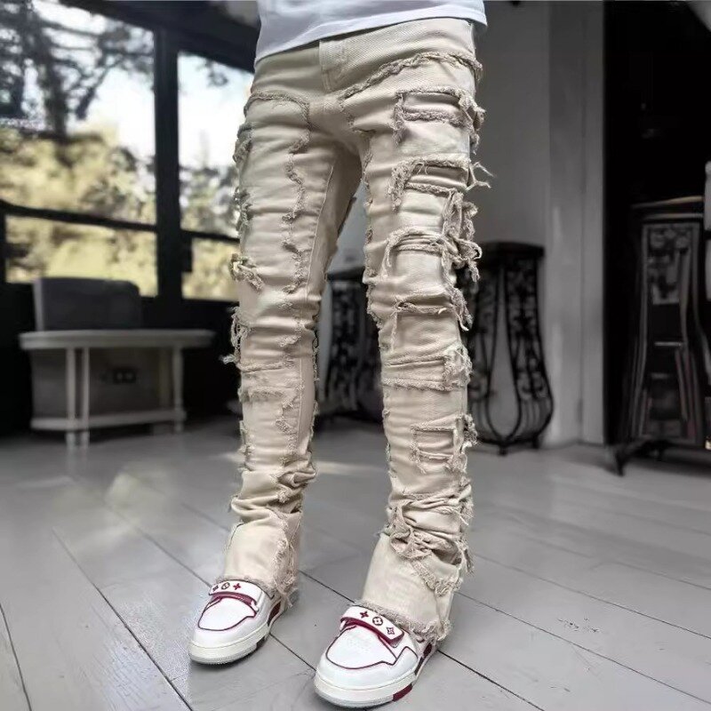 Celana pria baru Musim Semi Musim Panas 2024 celana kaki lurus Denim tambalan elastis warna polos modis