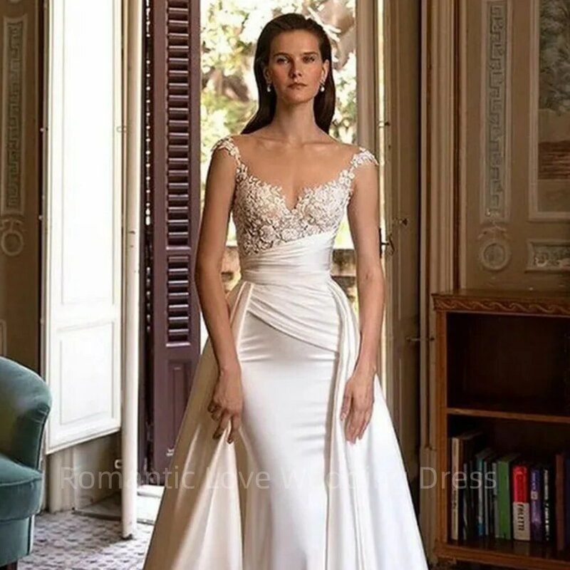 Wspaniała suknia ślubna syrenka długość podłogi rękawy Cap elegancka koronka aplikacja satynowe plisy sukienki panny młodej Vestidos De Novia