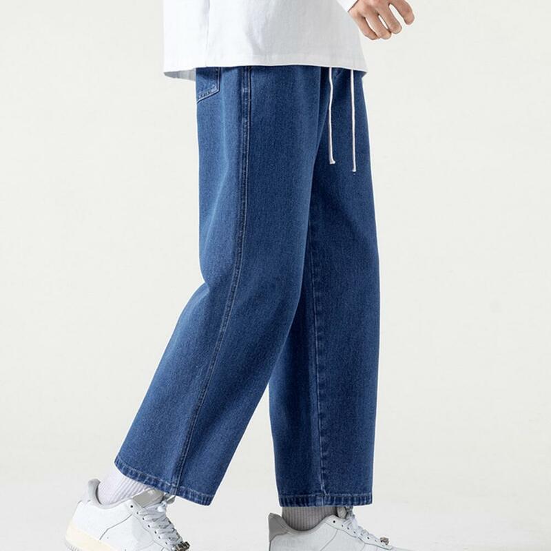 Celana Denim pinggang bisa disesuaikan, celana Jeans Retro pria lurus longgar dengan tali serut pinggang elastis kaki lebar lembut untuk pergelangan kaki