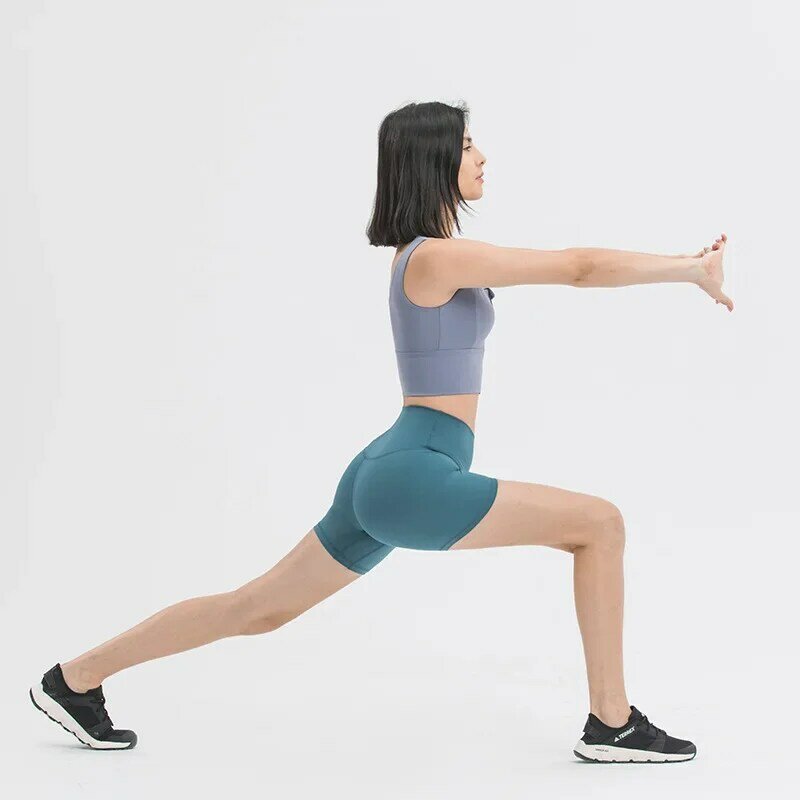 Nuovi pantaloncini da yoga nudi in tinta unita a vita alta pantaloni sportivi da allenamento elastici attillati con culo pesca per le donne