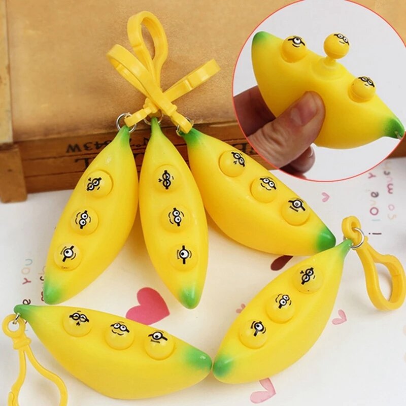จี้รูปกล้วยตลกสำหรับของขวัญสำหรับเด็กพวงกุญแจคลายเครียดของเล่นที่บีบอัดเพื่อคลายเครียด