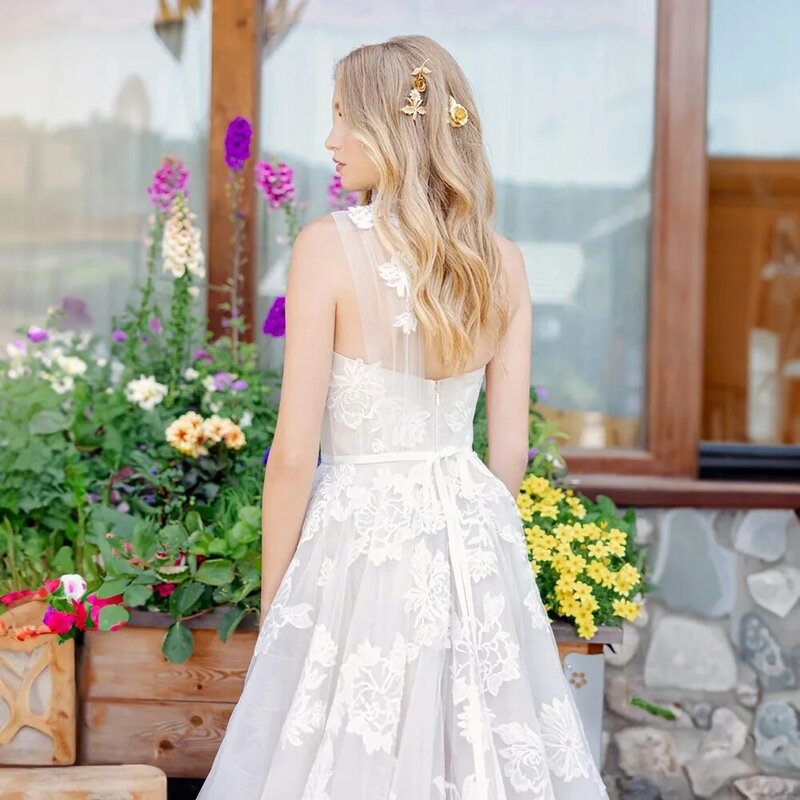 Idealne eleganckie suknie ślubne dla kobiet z koronką bez rękawów tiulowa koronka bez rękawów przepiękne suknie ślubne szata De Mariée