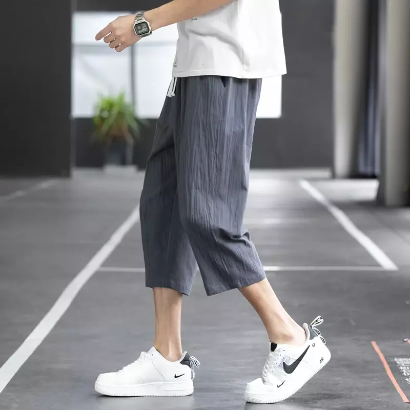 Celana kasual pria Musim Panas 2024 celana panjang lurus sembilan poin tren gaya Korea Linen longgar katun dan Linen liar