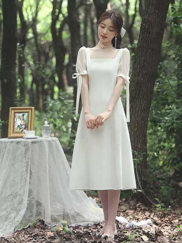 Französisches helles elegantes weißes Kleid bei Hochzeit/Reise/Party für Frauen im Frühling und Sommer