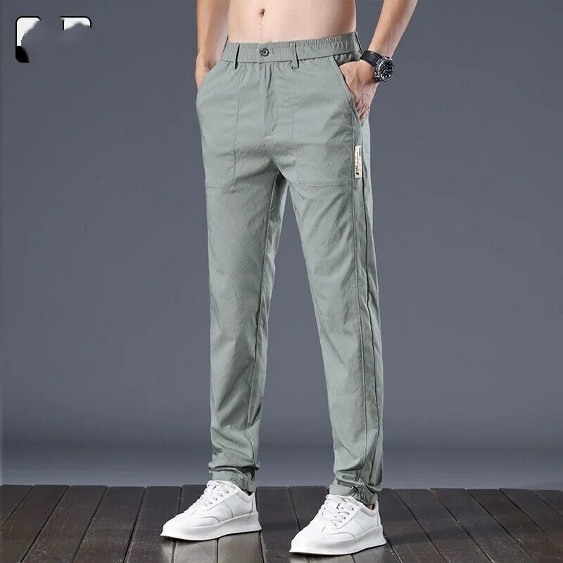Letnie nowe męskie spodnie dojeżdżające do pracy w jednolitym kolorze z gwintem Średni guzik w talii Luźne spodnie w młodym stylu Modne proste spodnie