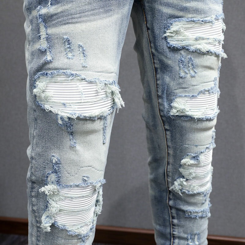 Streetwear modne dżinsy męskie niebieskie w stylu Retro rozciągliwe chudy krój z dziurami dżinsy męskie skórzane markowe spodnie Hip Hop
