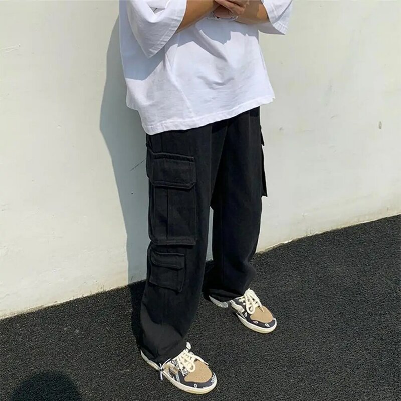 Chmielowe spodnie Cargo Streetwear męskie spodnie bojówki z wiele kieszeni szerokimi nogawkami miękka oddychająca tkanina styl hiphopowy jednolity kolor w połowie