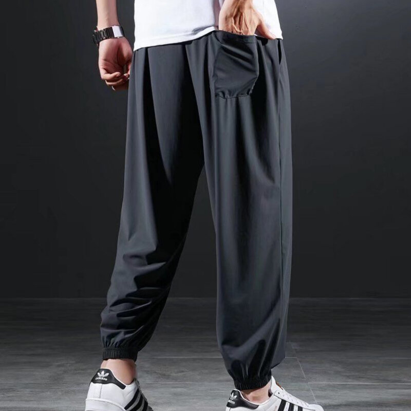 Letnie szybkoschnące lodowy jedwab spodnie na co dzień męskie ultracienkie elastyczne dziewięciopunktowe luźne, solidne spodnie ze ściąganą nogawką 7XL