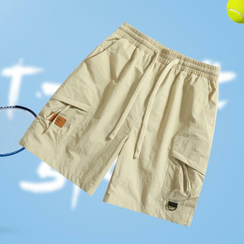 Pantalones cortos deportivos para hombre, Shorts Cargo versátiles con cinturilla ajustable, múltiples bolsillos, estilo callejero, moda de verano, color sólido