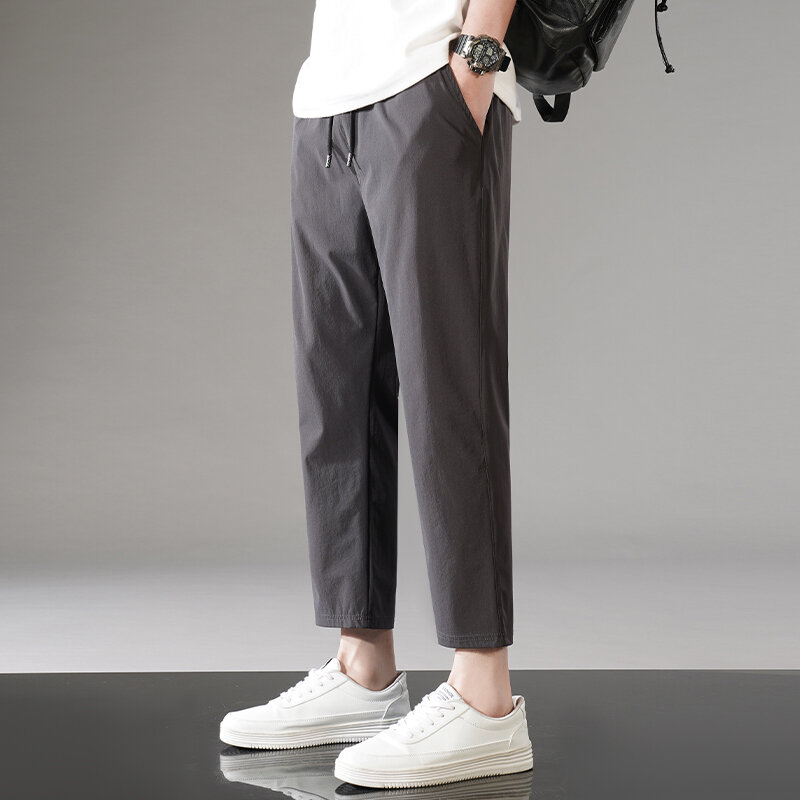 Grundlegende einfarbige kurze Hosen Herren bekleidung elastische stilvolle Kordel zug Sommer dünne Sporttaschen gespleißt koreanische Freizeit hose