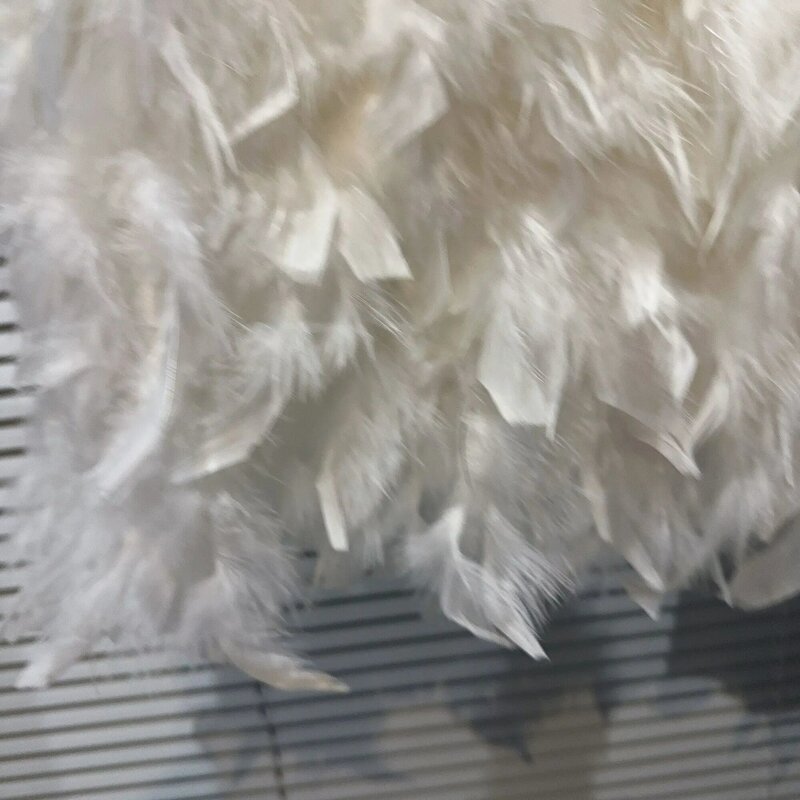 Falda-Mini saia Bodycon curta de pele sintética feminina, penas, elástico na cintura, outono, nova coleção, 40