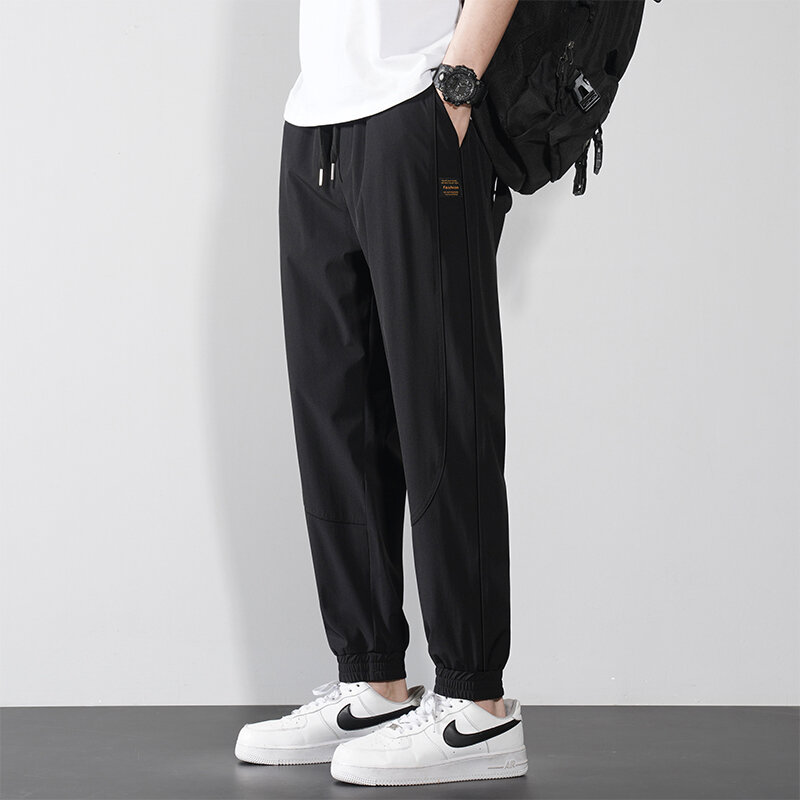 Trendy Summer Men's Solid Pockets Drawstring Elastic Waist Ice Silk Fabric Loose Bound Feet Wide Leg Trousers Ankle Length Pants