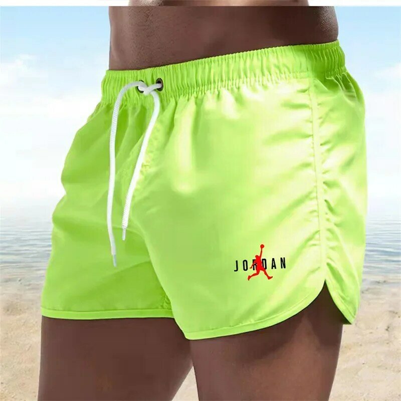 2024 mode baru celana pendek pantai olahraga pria musim panas celana panjang ringan saku bernapas dan cepat kering pantai Hawaii