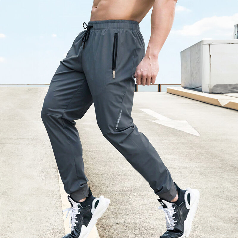 Celana panjang pria, celana panjang regang kasual pinggang elastis Jogging luar ruangan latihan kebugaran bernafas musim panas