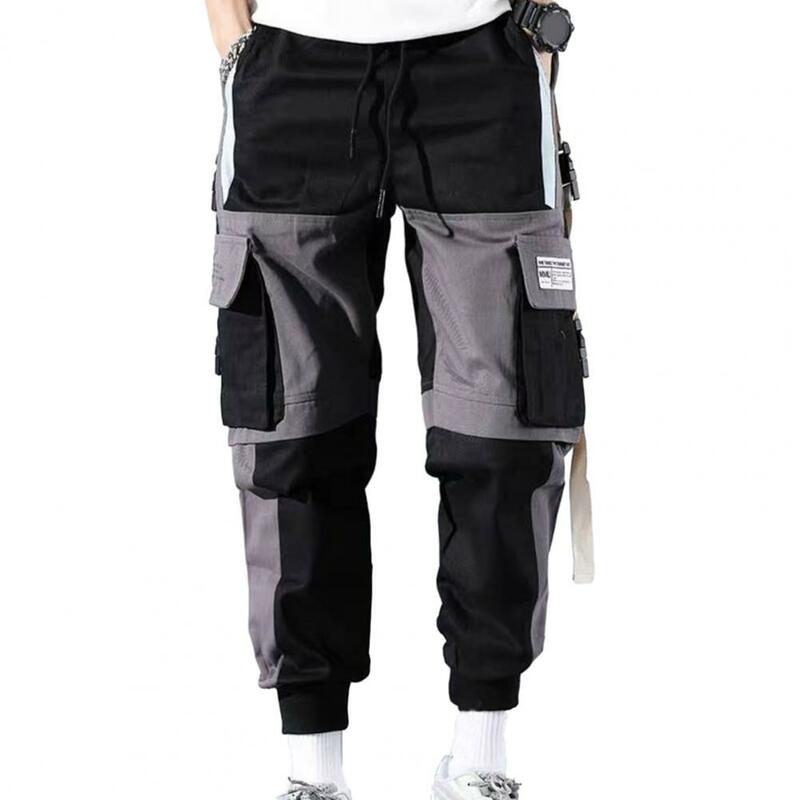 Calça cargo com bloco colorido masculina com bolsos múltiplos, calça solta para calor, streetwear hip-hop, decoração de fivela