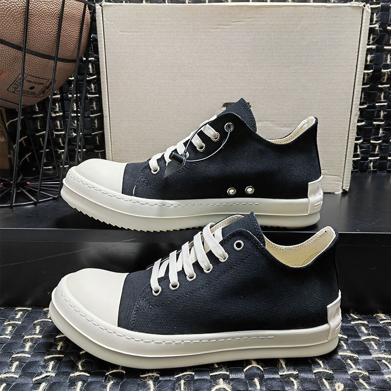 RICK Retro suola spessa punta tonda scarpe di tela basse per coppie Sneakers Casual Unisex in bianco e nero