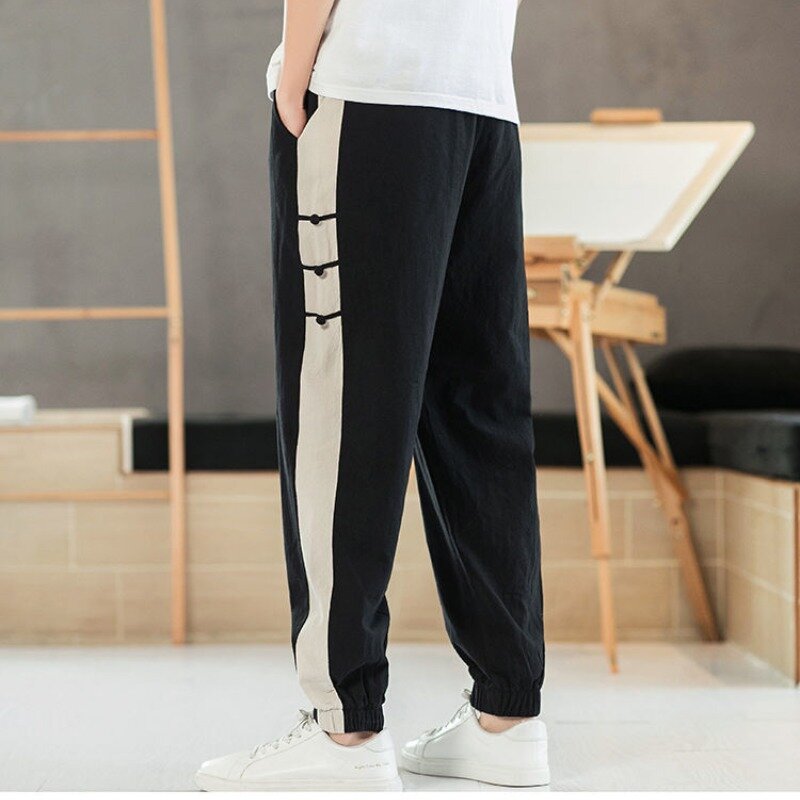 Chiński styl męski 2024 lato nowy patchwork wysokiej talii elastyczne kieszenie w jednolitym kolorze na wygodne luźne spodnie na co dzień