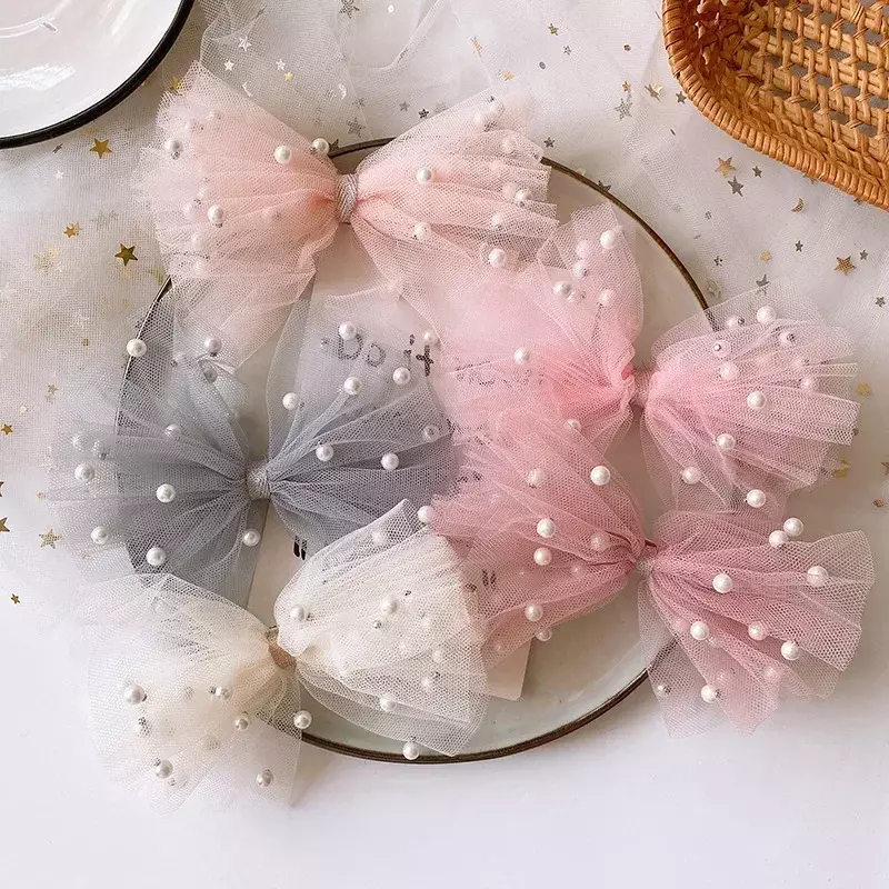 Nuova ragazza dolce coreana bella imitazione colorata filato di perle fiocco anatra Clip per bambini moda forcine accessori per capelli