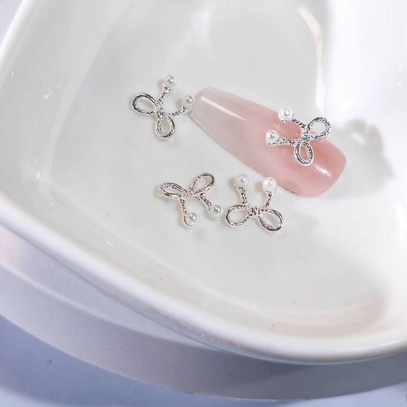 10 pz metallo oro argento Nail Art Charm Bow Bowknot a forma di strass per unghie fai da te perla 3D Nail Art decorazione accessorio per Manicure