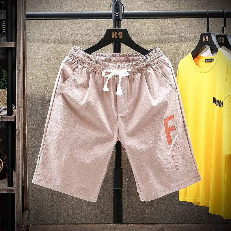 Pantaloni al ginocchio Casual per ragazzi elastici a vita alta alla moda 2024 nuovi vestiti maschili estivi Trend All-match tasche larghe pantaloncini con coulisse