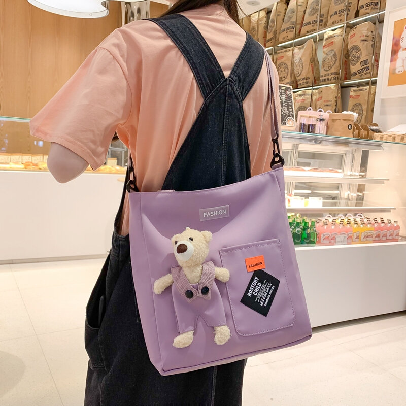 Tas bahu mode sederhana untuk wanita tas Messenger kanvas Solid tas sekolah siswa tas tangan banyak saku tas wanita