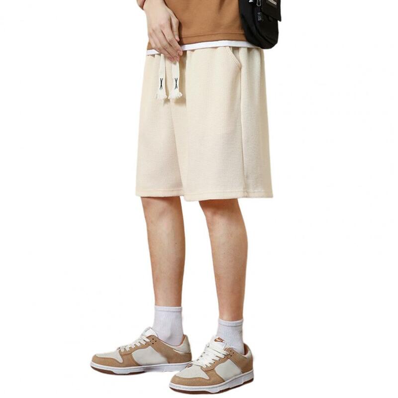 Celana pendek atletik pria, celana pendek olahraga pinggang elastis kantong kaki lebar tekstur wafel untuk Musim Panas Atletik serbaguna