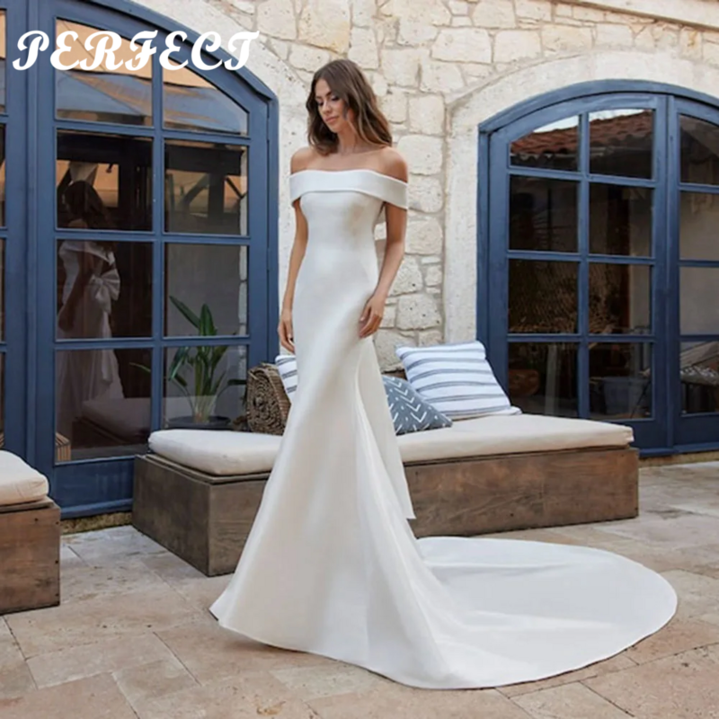 Gaun pernikahan Satin putri duyung sempurna dari bahu gaun pengantin dengan kancing busur kembali pengantin buatan khusus Robe De Mariee