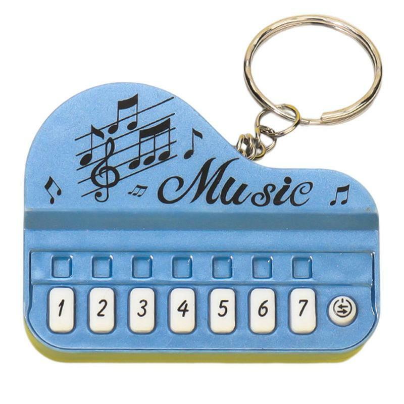 พวงกุญแจเปียโนนิ้วเล่นได้พวงกุญแจขนาดเล็กใช้งานได้จริงพร้อมไฟอุปกรณ์เครื่องดนตรีพวงกุญแจจี้ของขวัญ