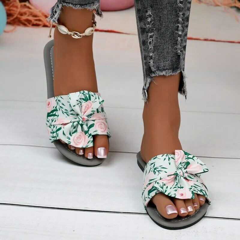 Nuovi slip-on con fiocco estivo di grandi dimensioni da donna, sandali piatti da spiaggia floreali verdi alla moda e semplici per abbigliamento all'aperto
