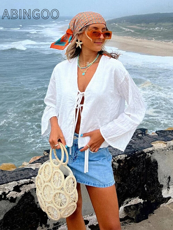Solide Schnür schleife Frauen aushöhlen V-Ausschnitt Tops Strand Sonnenschutz Baumwolle Leinen hemd lässig ausgestellte Langarm bluse