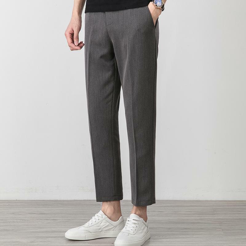 Modna męska półformalne spodnie do garnituru elastyczna talia małe stopy smukłe koreańskie plisowane zwężane spodnie spodnie męskie Streetwear W45