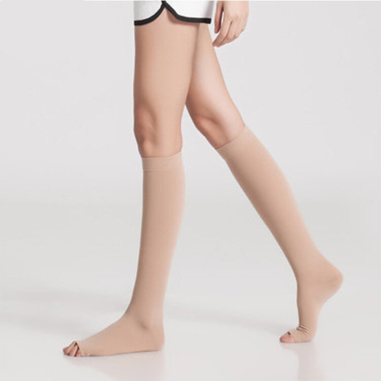 Une paire de chaussettes médicales élastiques à compression pour femme, manches mollet, enveloppes de pression à 3 niveaux, sport, volley-ball, course à pied