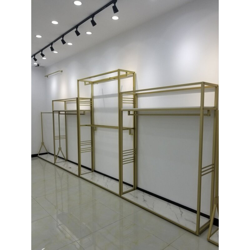 custom，Luxury Boutique Gold Wall Mount Clothing Rack Nesting Table Clothes Shelving Stand Garment Display Rack Clothing Store Fu