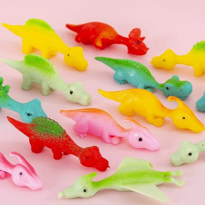 Catapulta de dedo creativa para adultos y niños, tirachinas de dinosaurio, juguetes de pared adhesivos para aliviar el estrés, 1-4 piezas