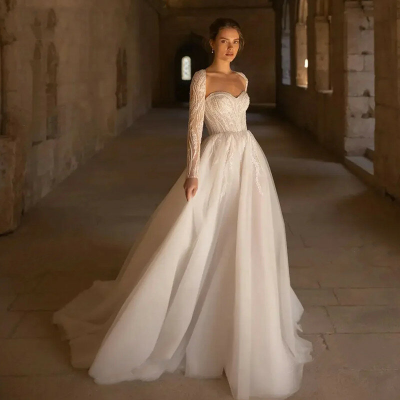 Luksusowa peleryna 2 w 1 biała suknia ślubna aplikacje z koralikami seksowne bez pleców, długa rękawy suknia ślubna kochanie pociąg