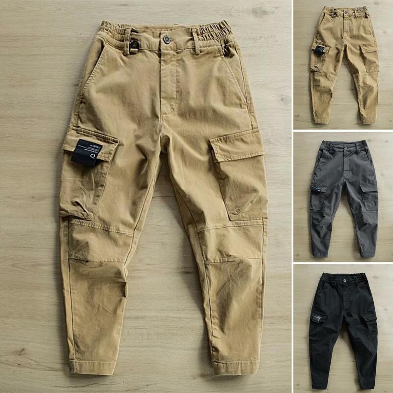 Stylowe spodnie męskie wygodne męskie spodnie dresowe Slim Fit jednolity kolor wiele kieszeni mężczyzn spodnie do fitnessu guziki