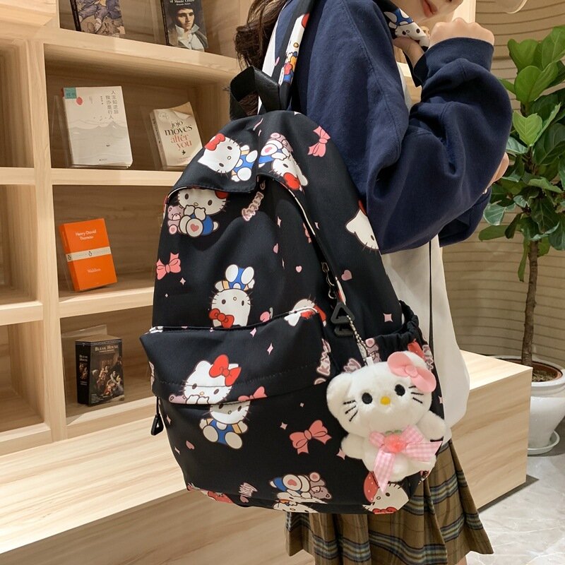 Sanrio KT กระเป๋าหนังสือลายแมวความจุขนาดใหญ่, กระเป๋าเป้สะพายหลังกันน้ำอเนกประสงค์สไตล์เกาหลีพิมพ์ลายกระเป๋าเป้เด็กผู้หญิงจุของได้เยอะ