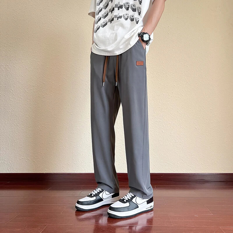 Celana panjang kargo untuk pria, celana panjang kasual gaya Korea lebar, celana Joger, celana kargo warna polos untuk pria 2024
