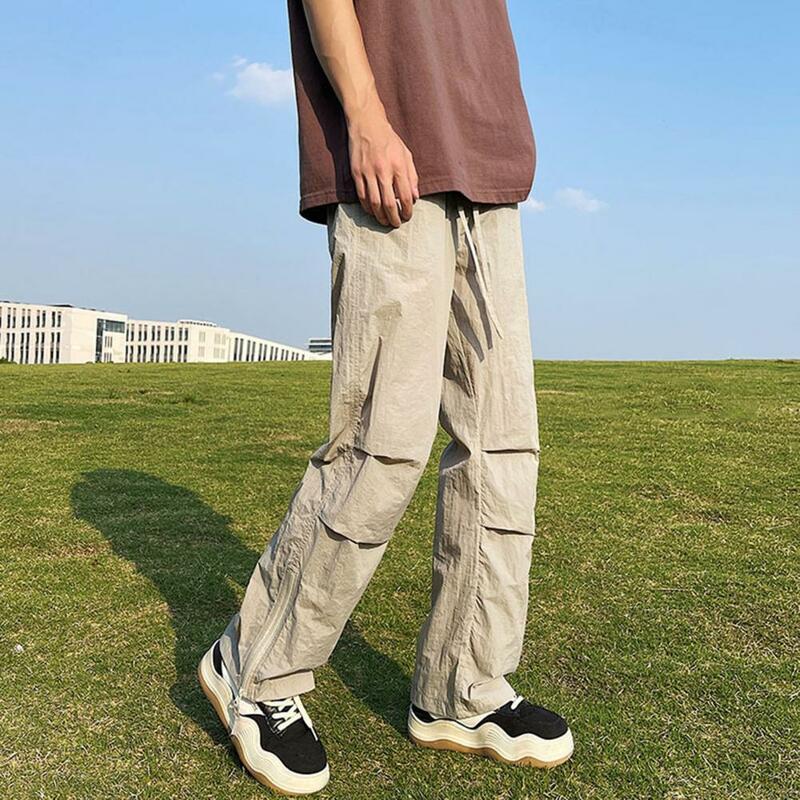 Celana panjang pinggang elastis pria, bawahan ukuran besar kaki lebar dengan ritsleting kantong samping untuk latihan Gym Jogging pinggang elastis