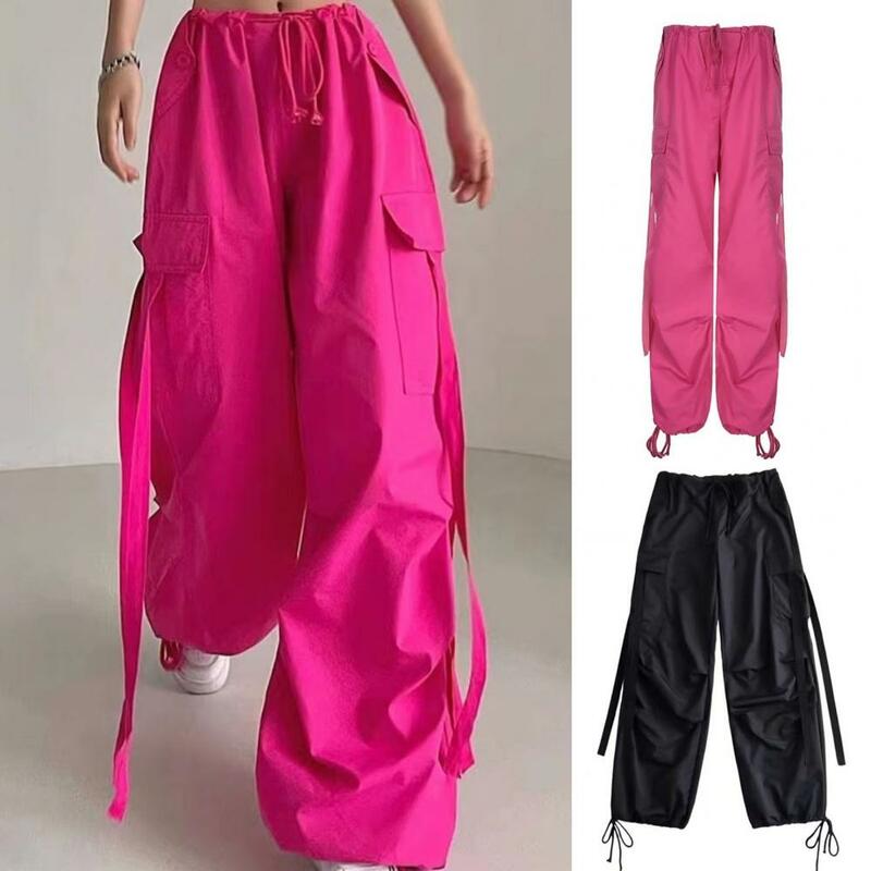Calças femininas de cintura alta com bainha de cordão, bolsos múltiplos, decoração com alça larga, estilo streetwear solto, monocromático