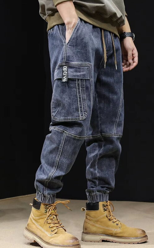 男性用の複数のポケットが付いたジーンズ、ルーズテーパーパンツ、ハーレムパンツ、伸縮性のあるウエスト、ストリートウェア、春と秋